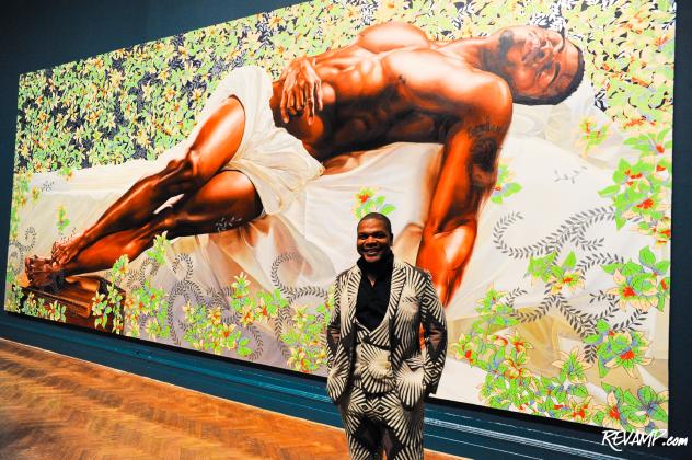 Artist Kehinde Wiley poses in front of his painting titled "Sleep" (2008, Oil on canvas, 132 x 300 inches).
